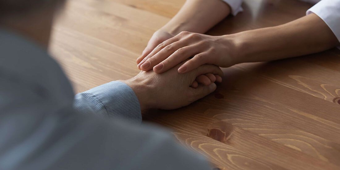 two people holding hands